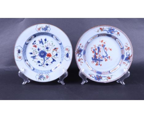 Two porcelain Famille Verte plates; one with floral decor, the other with scroll decor with a river landscape. China, Kangxi/
