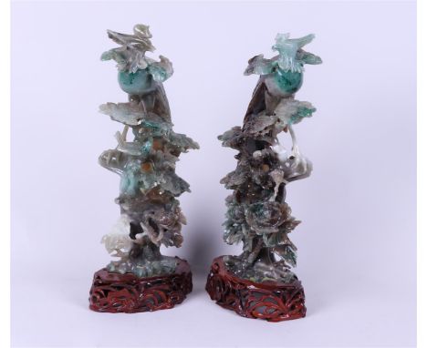 A jade Phoenix on wooden base. China, 20th century.H. 34 cm (inc basement).