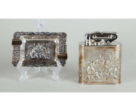 A lot consisting of a silver table lighter and an ashtray. Both with scenes from the Dutch 17th century. Hollandia Silversmit