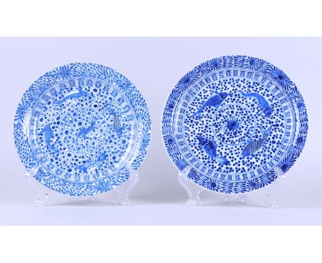 A lot of two porcelain plates with crab and perch decor, marked Kangxi. China, 19th century.Diam. 25 - 27 cm.