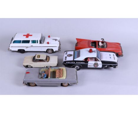 A lot of five vintage tin toy cars including Schuco.