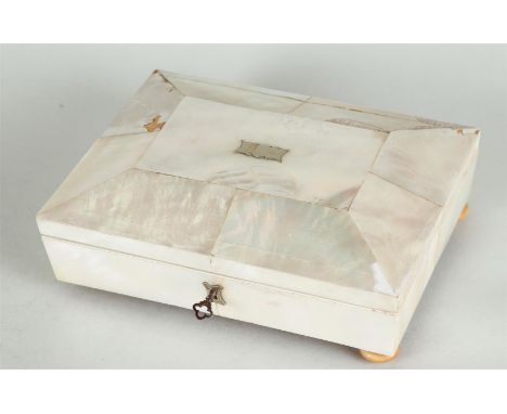 Mother of pearl box with silver spoons, forks and tea strainer.