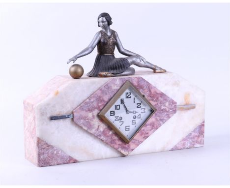 A marble Art Deco mantelpiece with a sculpture of a gymnast on it.40 x 20 x 50 cm. 