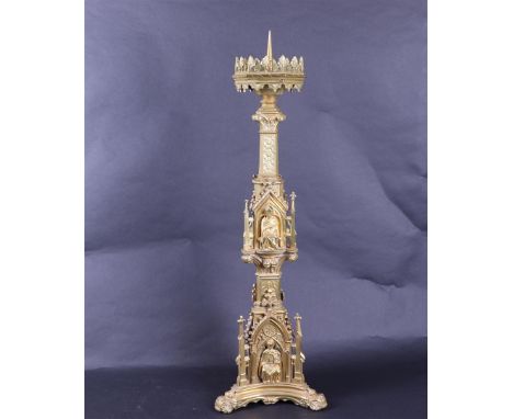 A neo-Gothic, ormolu, altar candlestick with images of church fathers. Approx. 1880.H.: 65 cm. 