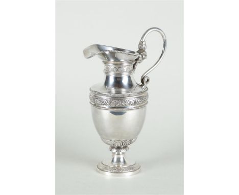A silver jug with floral and pearl edges and a silver handle. Jeweler Aubert D.J. / Aubert and Zn The Hague/Voorburg (1958/ …