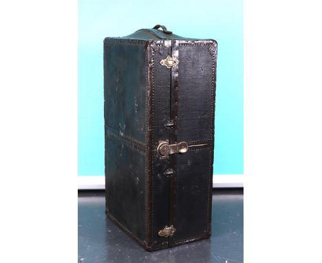 An American trunk covered with canvas and copper fittings. The contents with drawers and trouser hangers. (moisture damage).1