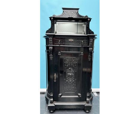 A blackened wooden buffet inlaid with mother of pearl and fitted with a cut mirror. ca. 1880.H.: 155 cm. 