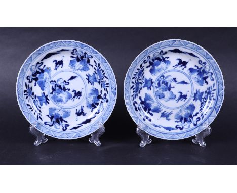 A set of two porcelain plates decorated with figures, animals and valuables, marked Kangxi. China, 19th century.Diam. 15,5 cm