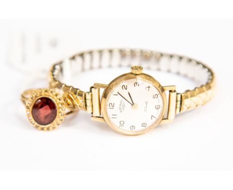 A Ladies Rotary yellow metal wrist watch, with 9 carat ring set with redstones