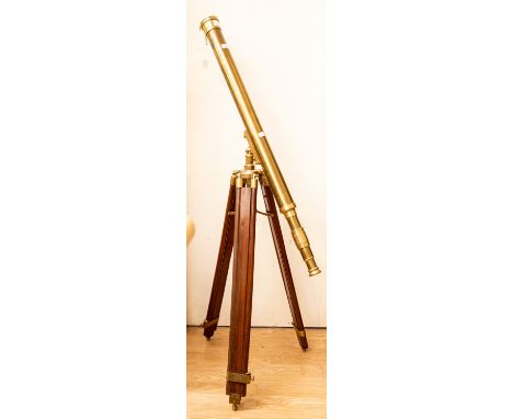A large brass telescope 40" tube on substatial wooden extending tripod
