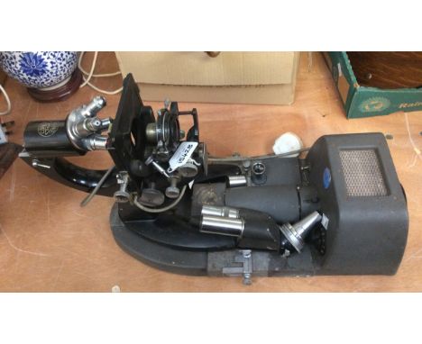 C. Baker of London wall mounted electric microscope 
