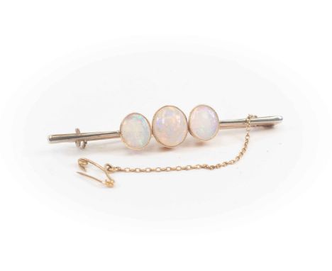 Yellow metal three stone opal bar brooch, approx 6gm gross