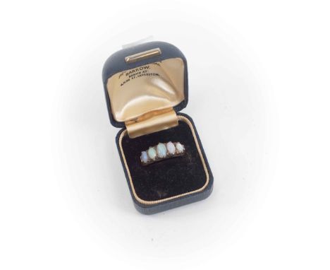 An opal ring set with  five graduated oval, mounted in 9ct gold, size N1/2, total gross weight approx 4gms