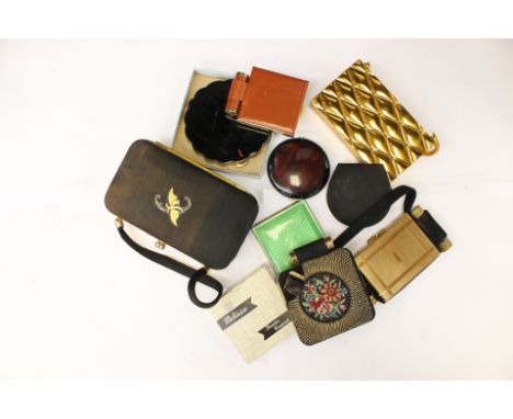 A box of powder compacts, most dating from 1930s including enamelled engine turned