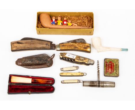Four old pen knives and two smaller pocket pen knives, amber cigar holder, an old corkscrew and a novelty boxed pipe 
