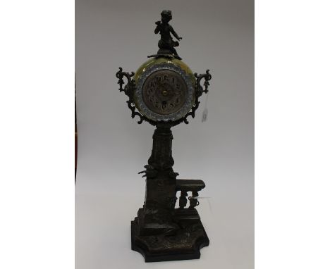 A tall ornate, green ceramic and spelter clock (makers name inside)