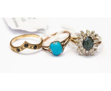 Three rings, including a nine carat gold diamond and sapphire wishbone ring, M1/2, a nine carat rose gold and turquoise ring,