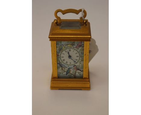 A miniature brass and enamelled carriage clock, decorative dial