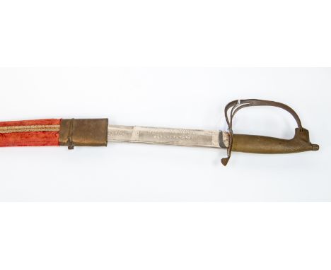 An Indian made decorative sword with brass hilt. Etched decoration to blade. Marked Made in India. Complete with scabbard.