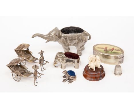 Frog white metal pin cushion, with two Elephant white metal pin cushions, a Silver thimble, two white metal Rickshaws, snuff 
