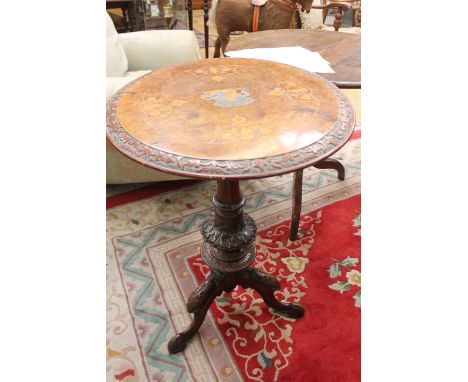 A George III oak fill top tripod table, turned column and standing on cabriole legs, together with an Edwardian mahogany tabl