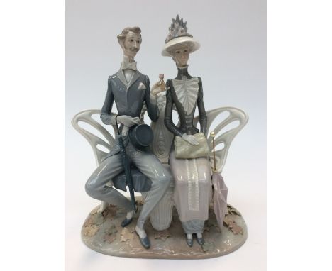 Lladro 'couple seated on a park bench' (umbrella re-glued, leaves re-glued) 