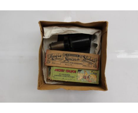 A boxed 1930's slide viewer marked "Patent 21309 DRGM 932949" together with five sets of Walt Disney glass slides all in orig