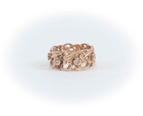 A 14 ct rose Gold ring with openwork floral foliate design, set with seven Diamonds, size O. Diamond weight approx 0.18 carat