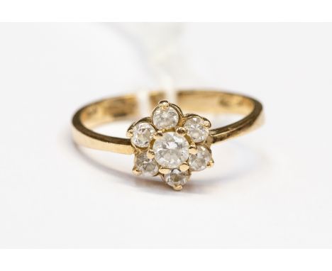 A 9ct gold white stone set flower head cluster ring, set in 14ct gold,  size O1/2, total gross weight approx 2.5gms