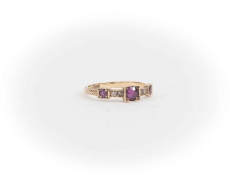 A Victorian ruby and diamond ring, three rubies in square settings, scroll/foliate shoulders, fifteen carat gold, approx size