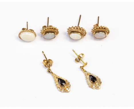 Two pairs of opal earrings set in nine carat gold along with a sapphire and diamond drop pair of earrings, combined total gro