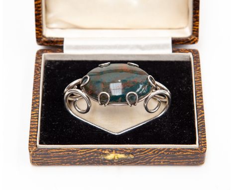 A Scottish bloodstone set large cloak toggle, the silver triangular frame complete in fitted box 