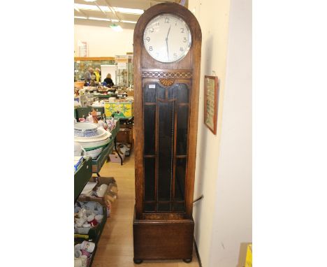 A George V oak cased longcase clock, silvered dial, triple weighted movement, pendulum