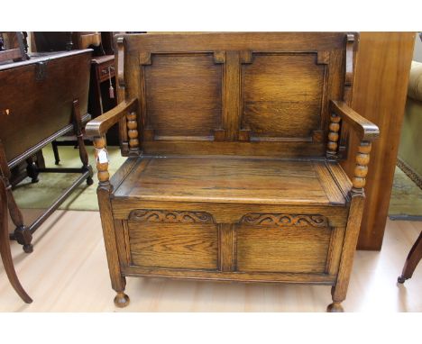 A Monks bench hall seat with flip top, hall table