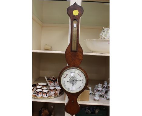 A mahogany wheel barometer