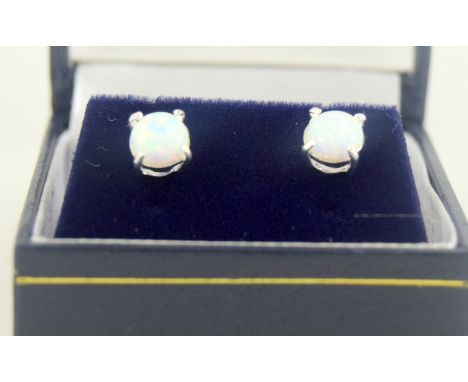 a pair of silver & opal stud earrings