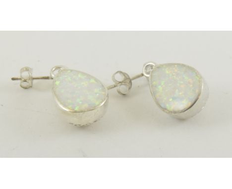 A pair of silver pear shaped opal earrings