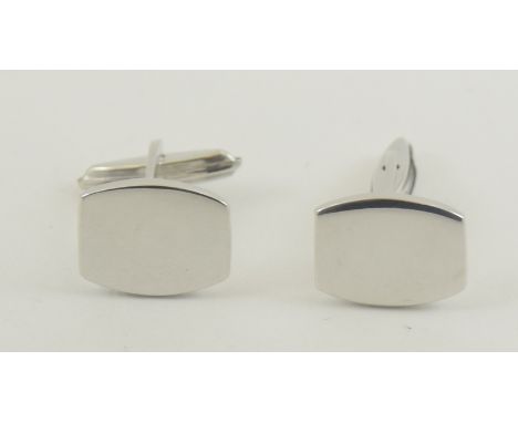 A pair of silver cufflinks with blank cartouche