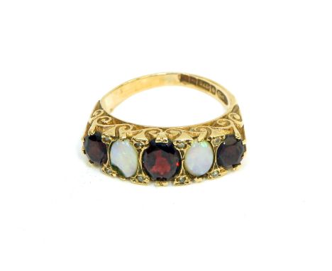 A 9ct gold ladies diamond, opal and garnet ring size M