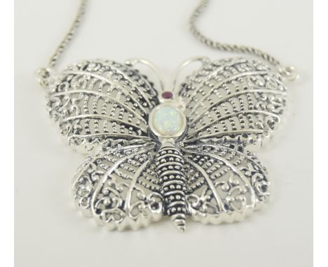 A substantial silver opal and garnet necklace in the form of a butterfly