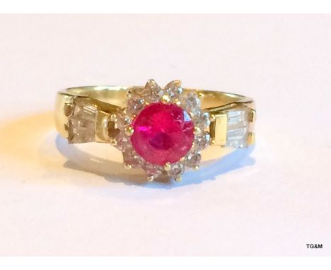 An 18ct gold baguette diamond and ruby ladies ring size p