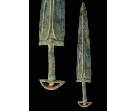 Ca. 2000 - 1000 BC.A bronze sword made via the lost-wax technique. The blade has a raised central fuller for strength and fur