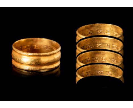 Ca. AD 1600- 1700. An early post-medieval gold posy ring with a large central ridge. The ring has an internal inscription rea