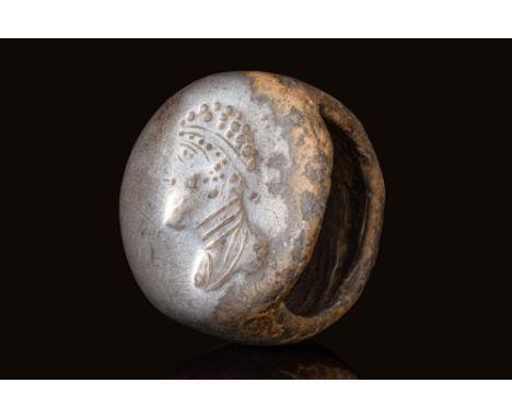 Ca. AD 100 - 300.A Roman silver ring composed of a round D-section widening on the shoulders to form a round bezel. The bezel