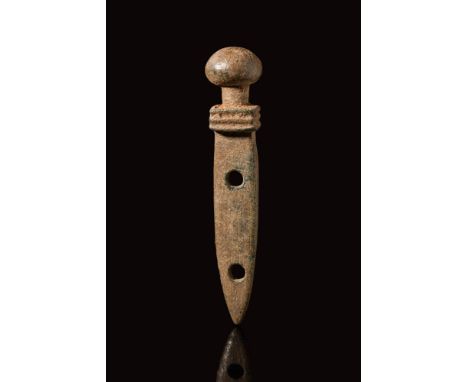 Ca. AD 100 - 300.A Roman bronze pendant shaped like a gladius, an iconic weapon of the Roman army. This kind of amulet was ro