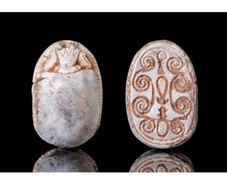 Middle kingdom, 2055 - 1790 BC. A Egyptian steatite scarab with naturalistic features. Beneath the domed insect is a hierogly