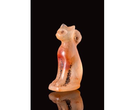 Late Period, Ca. 664 - 30 BC.An Egyptian amulet of Bastet, the cat-headed god. It is carved in agate and made in a naturalist