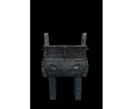 Late Shang Dynasty, Ca. 1300-1100 BC.A bronze cauldron, known as a ding. The ding comprises a rectangular body with a shelved