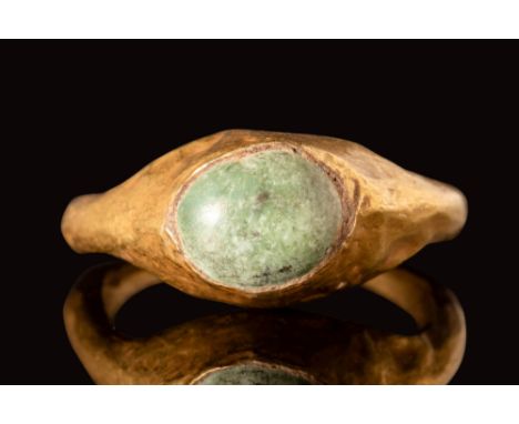 Ca. AD 100 - 300.A Roman gold ring with a round D-section hoop tapering on the bottom and enlarges on the shoulders to form a