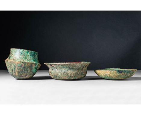 Ca. 500 - 300 BC.A collection of Etruscan, cast-bronze vessels composed of a jar and two bowls. The first vessel, on the left